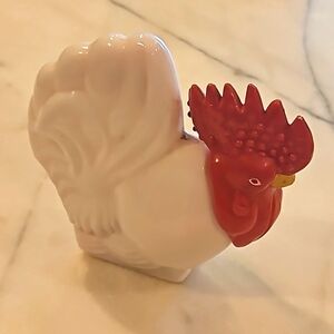 Milk glass Avon Rooster lotion bottle . Full of lotion.
